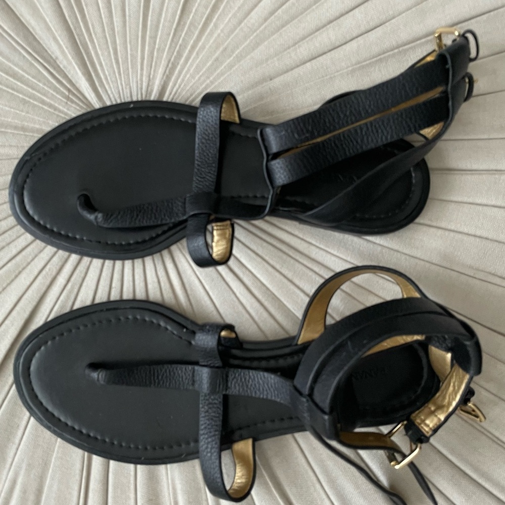 Black leather brand new Banana Republic sandals with gold buckle.